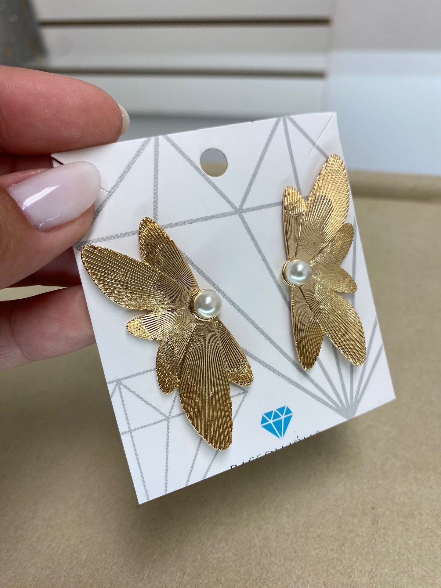 Gold Wing Earring Detail with Pearl